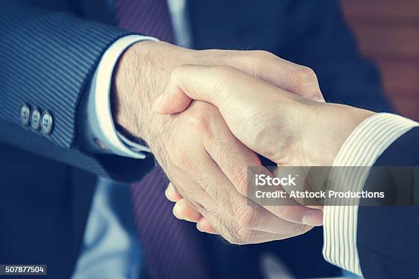 Handshake Of Businessmen In Vintage Tone Stock Photo - Download Image Now - Adult, Agreement, Bonding