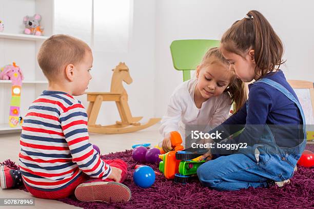 Kids Playing In The Room Stock Photo - Download Image Now - Activity, Beautiful People, Beauty