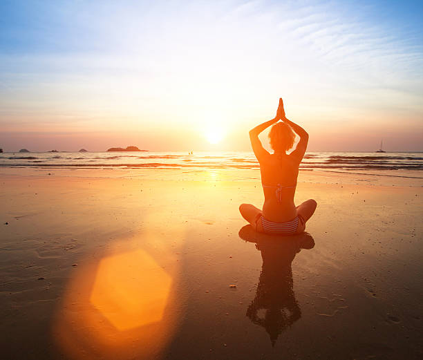 istock Yoga practicing at sunset, serenity and meditation. 507879633