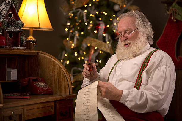 istock Santa Claus going over his naughty and nice list 507879947