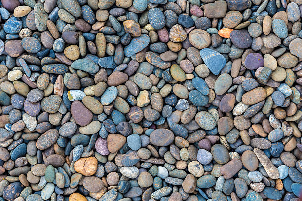 istock Sea stones background blue violet 507880394