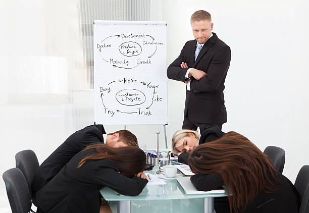 istock Businessman Looking At Colleagues Sleeping During Presentation 507880861