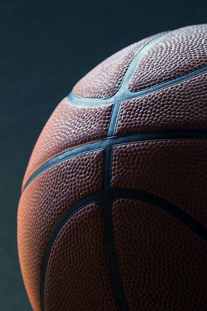 istock Basketball with mood lighting on black background 507881137
