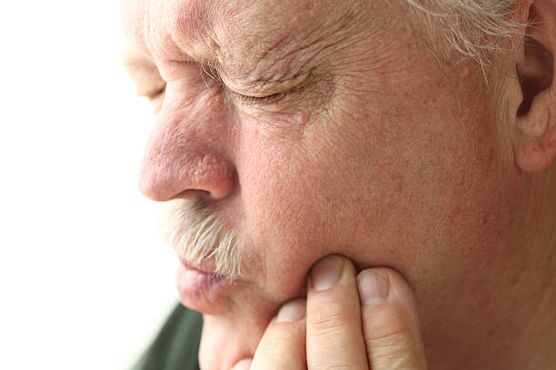 istock Senior man with tooth pain 507881411