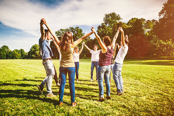 istock Teamwork of Friends Making a Circle, Holding Hands Together 507881873