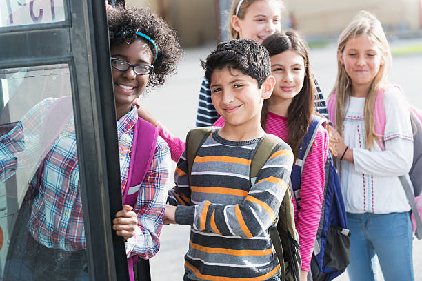 istock Children getting on school bus 507896491