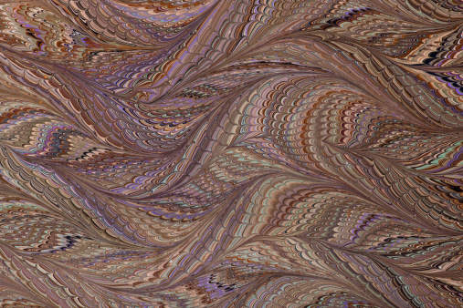 A sheet of marbled paper. Waved Gothic pattern style. Colors are warm and symbolic of Thanksgiving and autumn tones.
