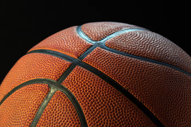istock Basketball with black background - horizontal 507898811