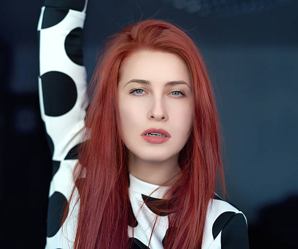 young beautiful red hair venezuelan woman lifestyle in the city of milan outdoor street