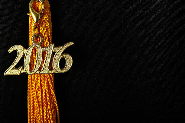 istock Tassel with 2016 pendant on black graduation hat 507900034