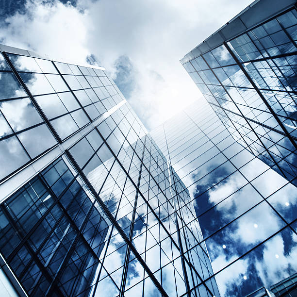 istock glass skyscraper reflecting the blue sky 507901338