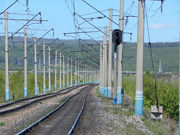 istock Power poles on the railway, the semaphore. 507901367