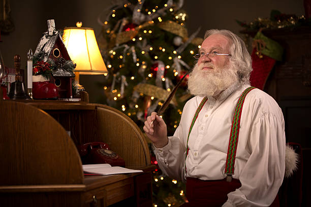 istock Santa Claus thinking how to reply to a letter 507903095