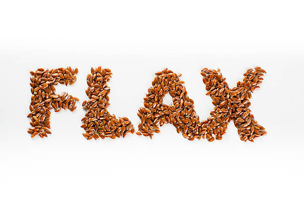 istock Word flax piled of flax seed on white background. 507903744