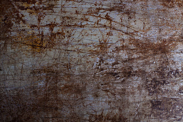 istock Wallpaper of scratch and rusty metal, painted on gray. 507904754