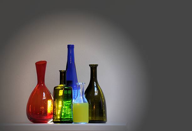 istock Vintage multicolor group of bottles in a row. 507905710