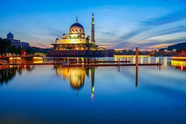 istock Beautiful reflection of Putra Mosque in lake during blue hour 507906320
