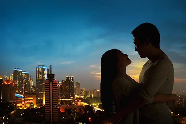 istock Silhouette of couple on the rooftop 507907616