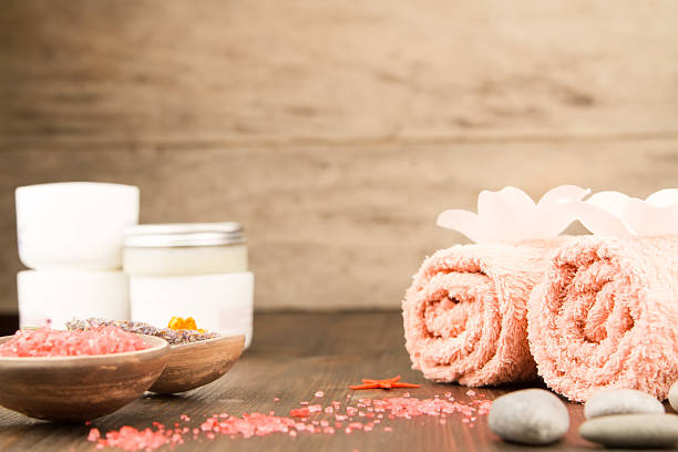 istock Spa composition with towels, sea salt on wooden background. Aromatherapy. 507907956