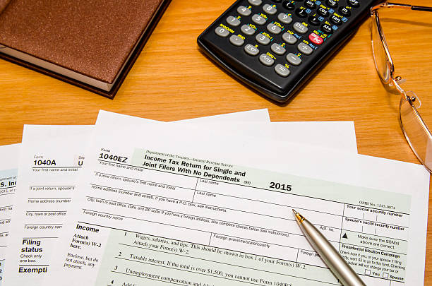 istock tax form 1040 for 2016 year with calculator 507908348