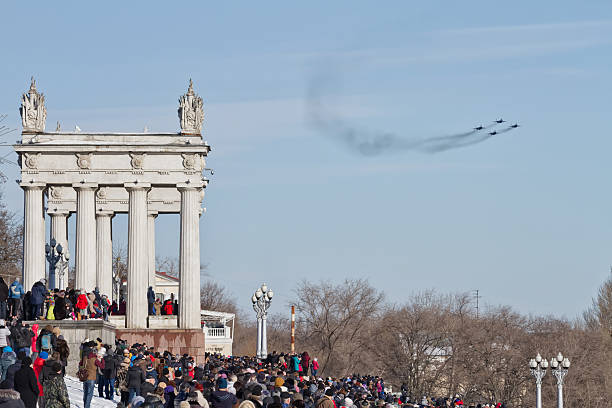 people came to see  parade of military aviation Volgograd, Russia - January 30, 2016: A large number of people came to the Central promenade to see the parade of military aviation supersonic airplane editorial airplane air vehicle stock pictures, royalty-free photos & images