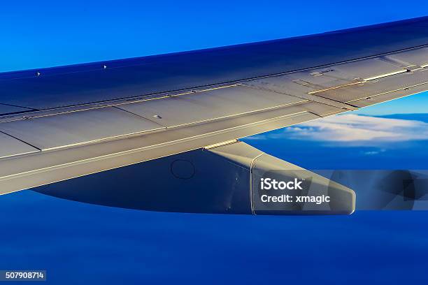 Plane Wing Above Sky And Clouds Stock Photo - Download Image Now - Above, Air Vehicle, Aircraft Wing