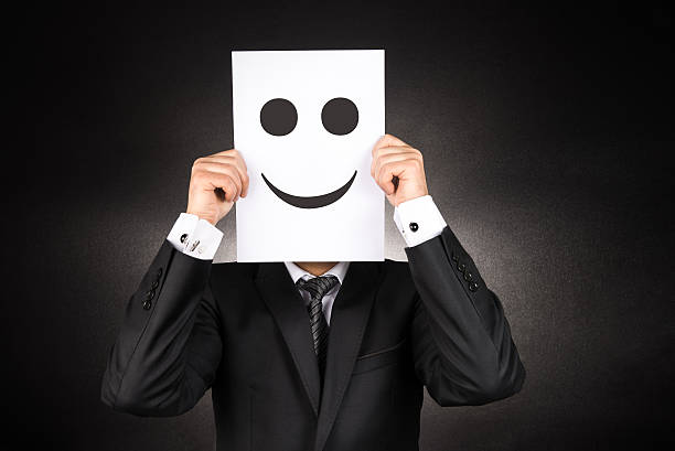 istock Businessman holding paper with smiley face 507909862