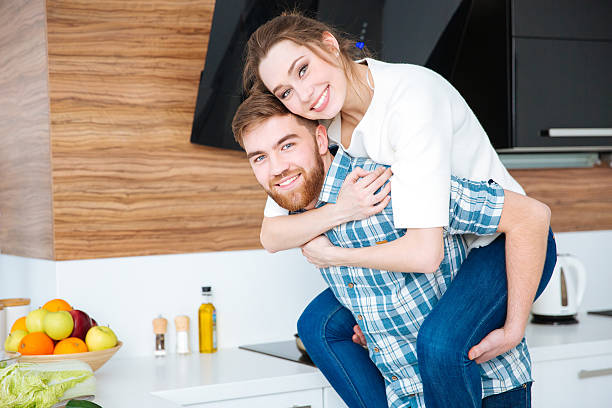 istock Happy beautiful couple having fun on the kitchen together 507912072