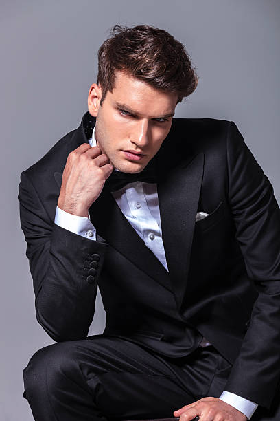 istock Elegant young business man looking down 507912196