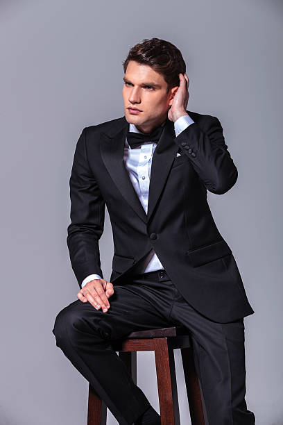 istock Attractive young business man fixing his hair. 507912492