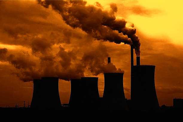 istock View of smoking coal power plant at sunset 507912806