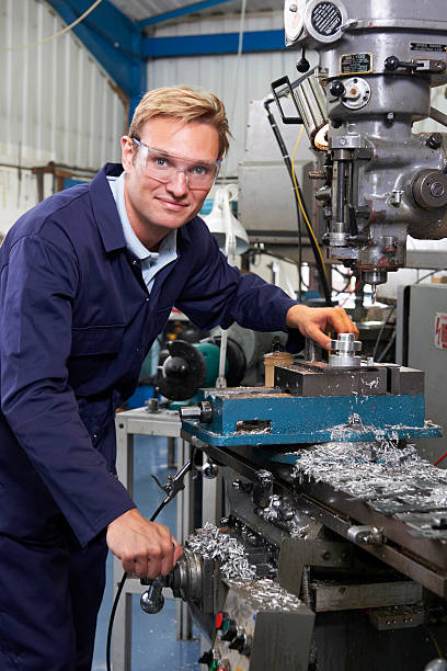 istock Portrait Of Engineer Using Drill In Factory 507918043