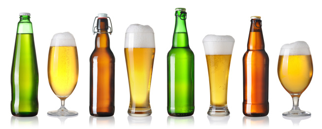 glasses and bottles of beer on a white background