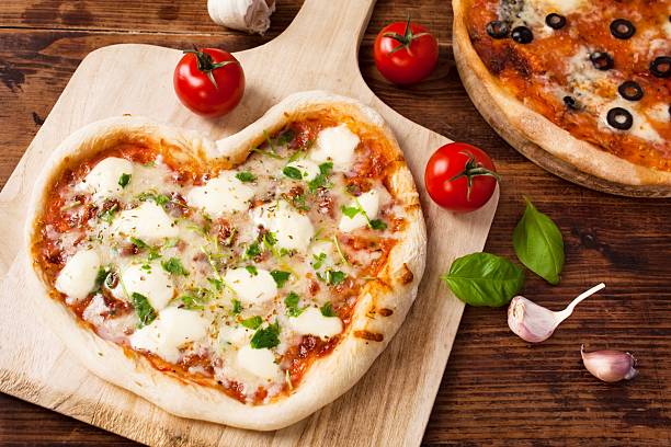 istock Romantic Heart Shaped Italian Pizza Margherita 507919197