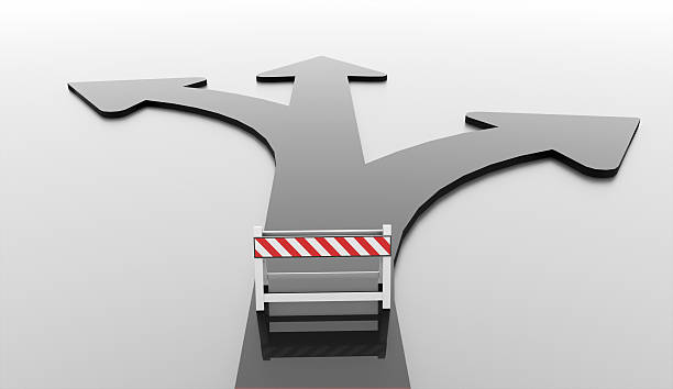 istock Black three arrows way and road barrier 507919285