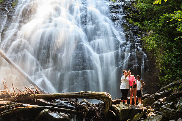 Crabtree Falls Nelson County, Virginia, USA - July 13, 2014: A family takes selfie in front of the Crabtree Falls located in George Washington National Forest, Virginia. george washington national forest stock pictures, royalty-free photos & images