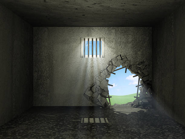 Old Grunge Prison Interior with Broken Concrete Wall
