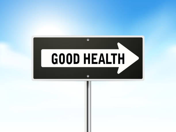 istock good health on black road sign 507921475