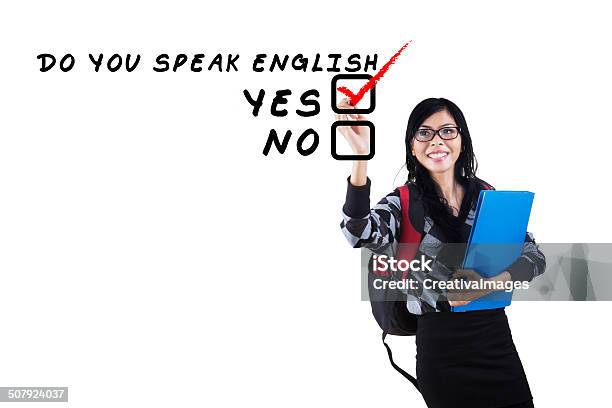 English Tutor Writes On Whiteboard Stock Photo - Download Image Now - Adult, Asian and Indian Ethnicities, Beautiful People