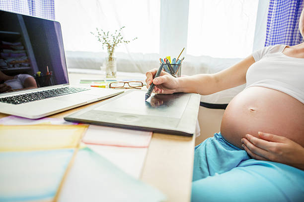 istock Pregnant woman working from home 507924549