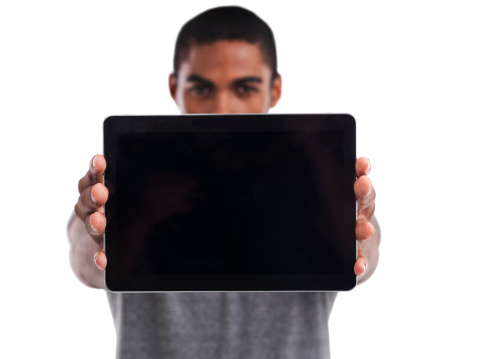 Cropped shot of a young man holding a digital tablet