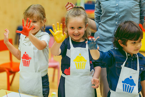istock Children With Painted Hands With Watercolors 507954126