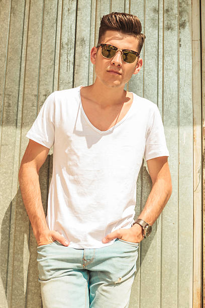 istock relaxed man pose outside with both hands in pockets 507954250