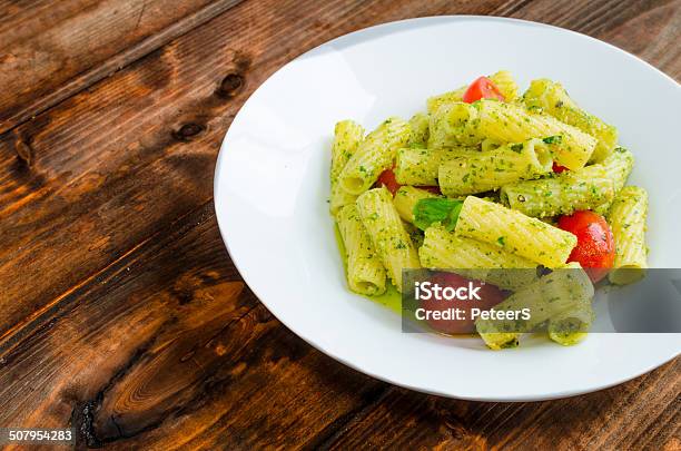 Rigatoni Pasta With Genoese Pesto And Sherry Tomato Stock Photo - Download Image Now