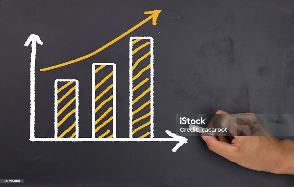 financial graph on blackboard Business Stock Photo