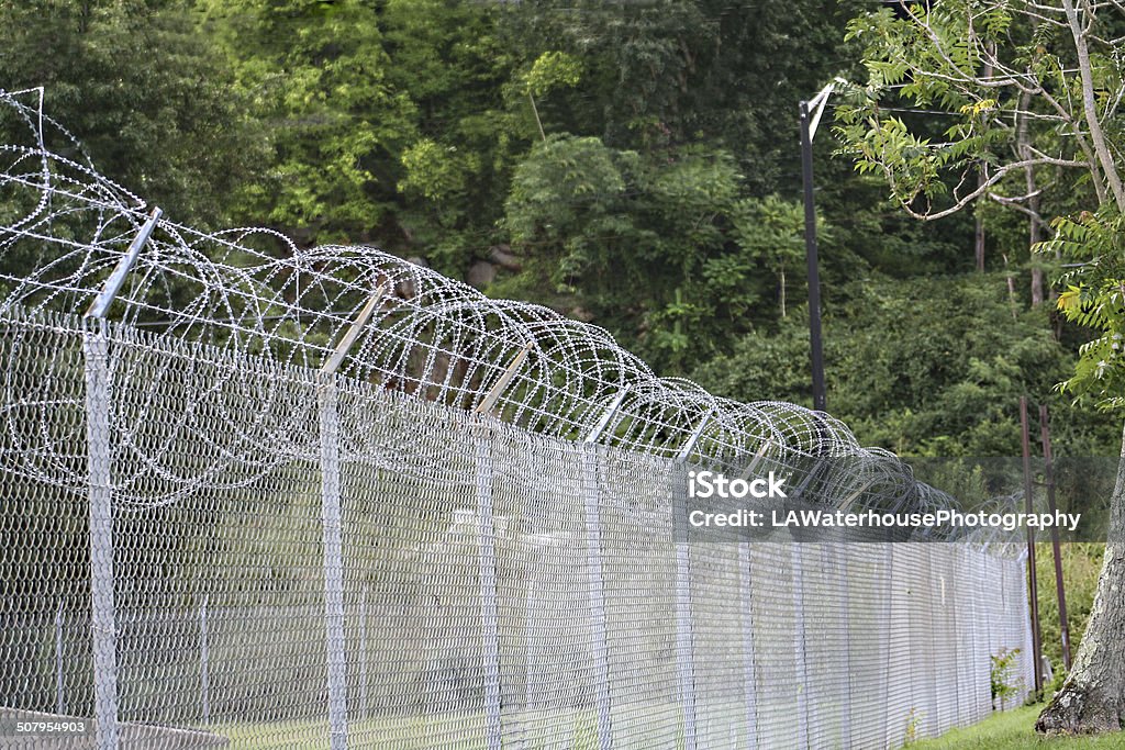 Protected Razor wire around a USMC outpost is an intimidating site. Fence Stock Photo