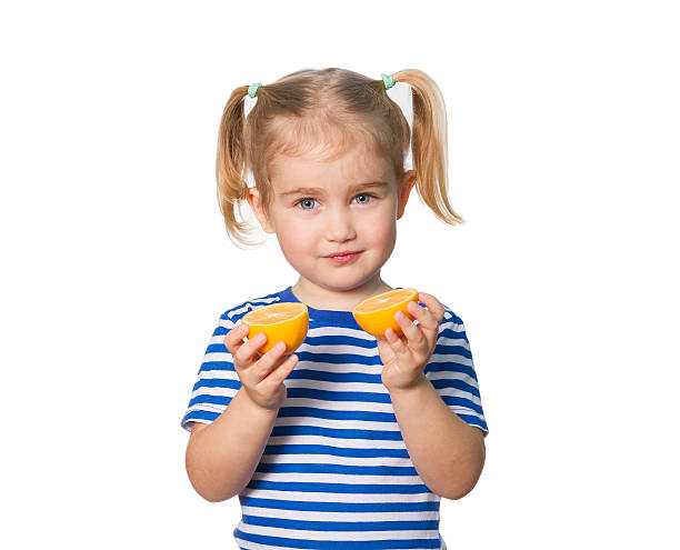 istock Little Funny girl keeps lemons 507955294
