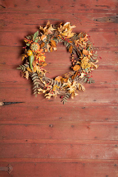 istock Autumn Wreath on an Old Rustic Barn Door 507955393