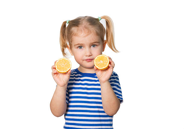 istock Little Funny girl keeps lemons 507955396