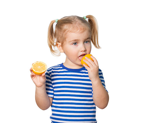 istock Little Funny girl keeps lemons 507955480